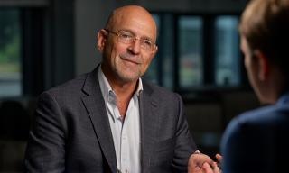 Person being interviewed on camera with professional lighting